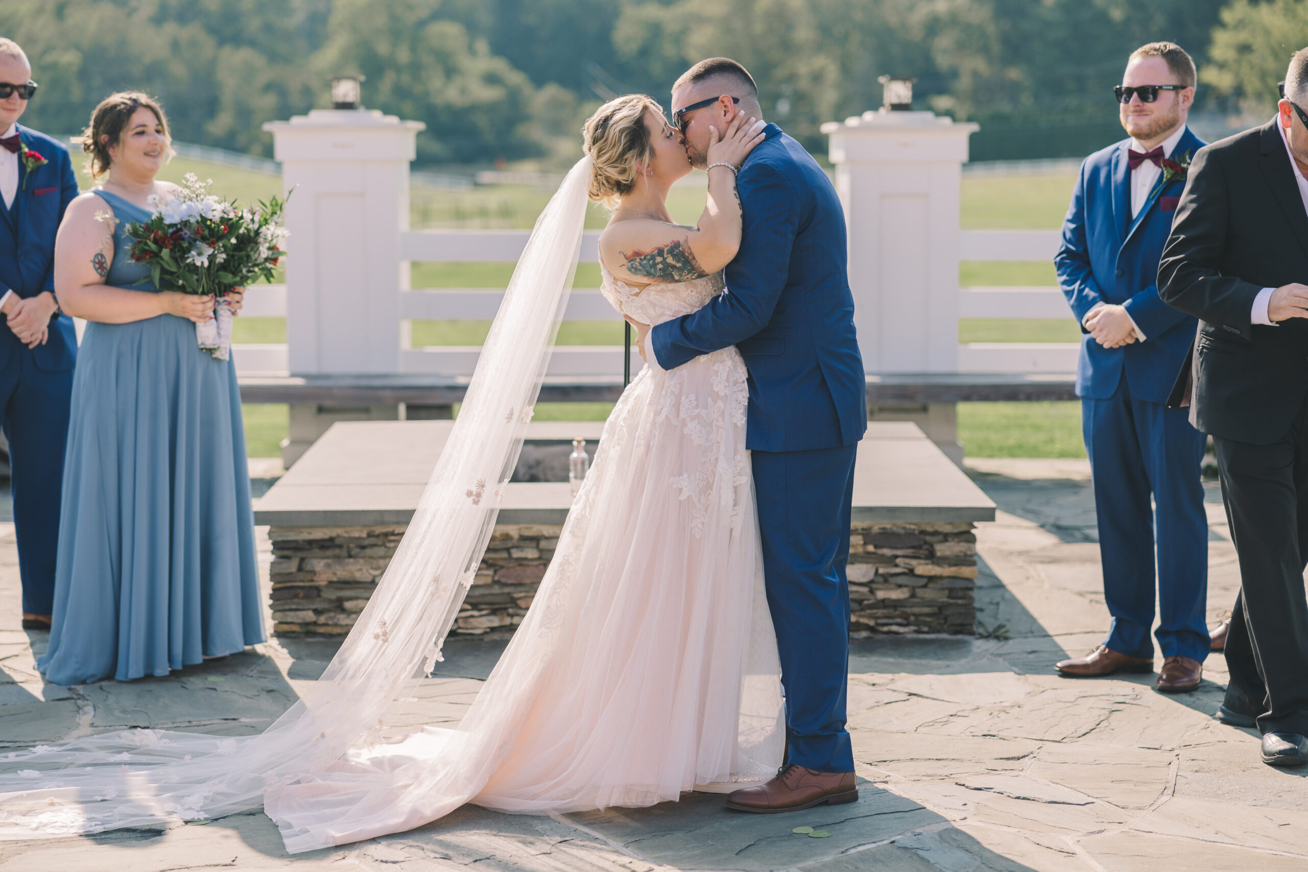 Bride and Groom Share first kiss at their Friedman Farms wedding